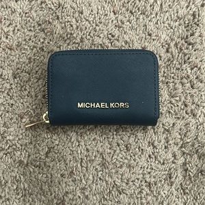 Lightly used navy blue small Michael Kors wallet with gold accents